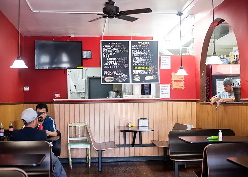 The restaurant area is tucked inside the larger market. - MABEL SUEN