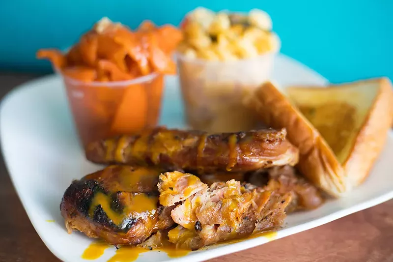 The "On The Ropes" turkey ribs come with house sweet potatoes and mac and cheese. - MABEL SUEN