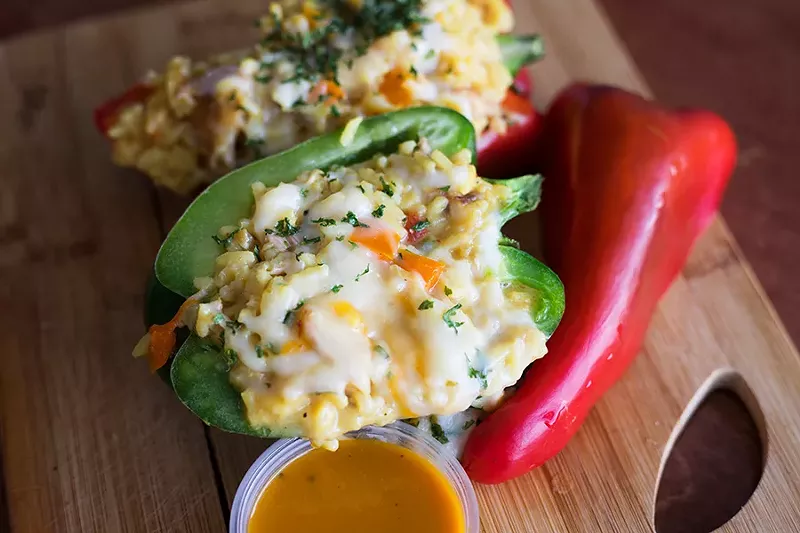 At TKO Grill, the stuffed peppers are filled with house-smoked turkey rib meat, rice and onions. - MABEL SUEN