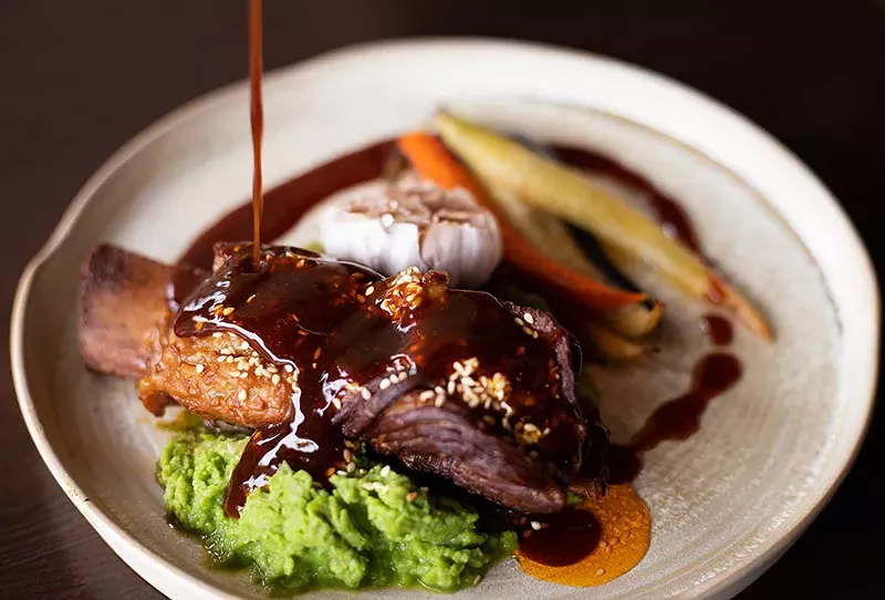 Like a perfectly cooked pot roast, the short rib meat falls away from the bone with barely the tug of your fork, leaving in its wake a pool of the mildly funky sambal jus. - MABEL SUEN