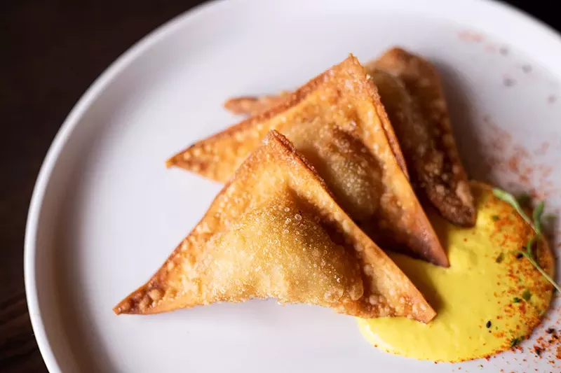 The lobster wonton reinvents the ubiquitous crab rangoon, subbing in lobster meat and a minimal dollop of cream cheese for the filling. - MABEL SUEN