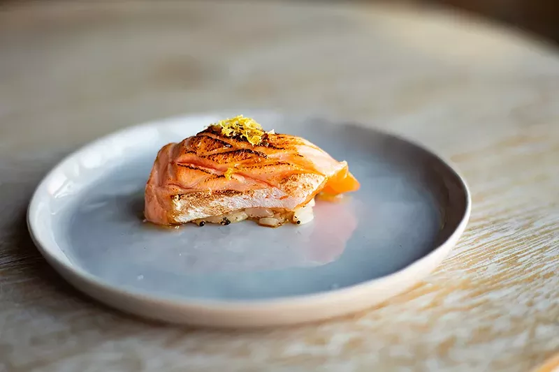 Benitoro serves seared salmon belly with lemon zest and a white soy sauce glaze. - MABEL SUEN