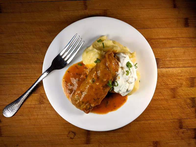 Pickled cabbage stuffed with minced pork and rice served with yellow maize porridge. - JOHN J. GODDARD