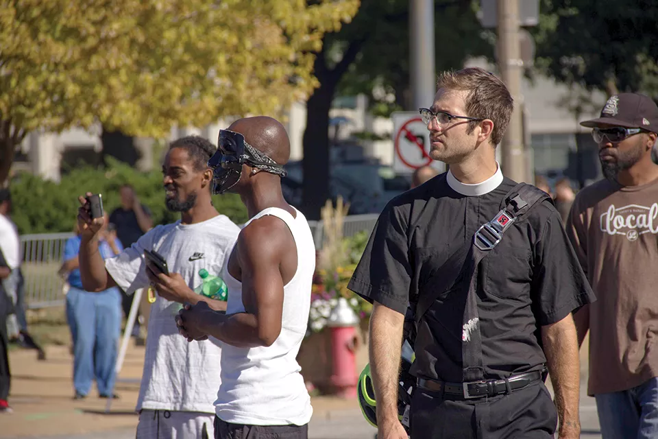 Father Jon Stratton in 2017 with people protesting police abuse in St. Louis. - DANNY WICENTOWSKI