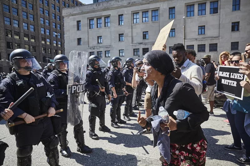 Maleeha Ahmad shouts at St. Louis police in 2017 after she was pepper sprayed while protesting the Jason Stockley verdict. - THEO WELLING