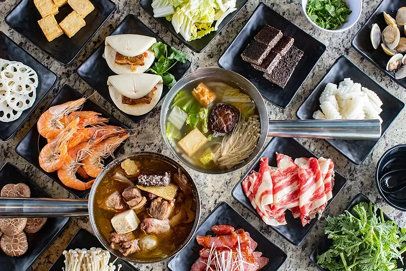 Ginger duck wok and beef hot pot with various add-ons, gua bao (pork belly bun) and sliced Taiwanese sausage. - MABEL SUEN