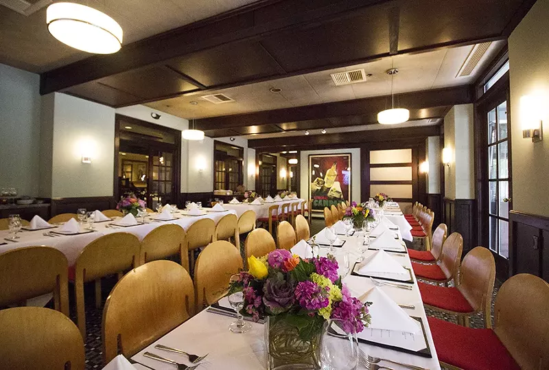 Herbie's dining room includes the same framed prints that graced the walls in the Central West End. - PHOTO BY MABEL SUEN
