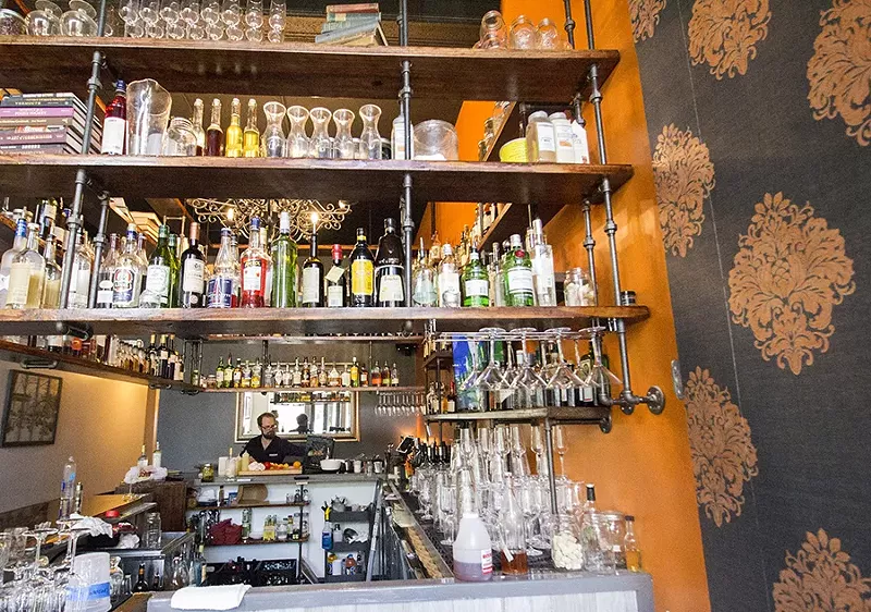 Travis Hebrank at work at the bar. - MABEL SUEN