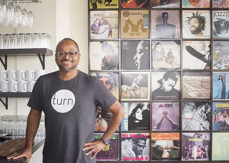 Chef David Kirkland's love of music is evident in the album covers that decorate the space. - PHOTO BY MABEL SUEN