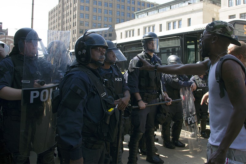 Police hold the line in downtown St. Louis. - PHOTO BY DANNY WICENTOWSKI