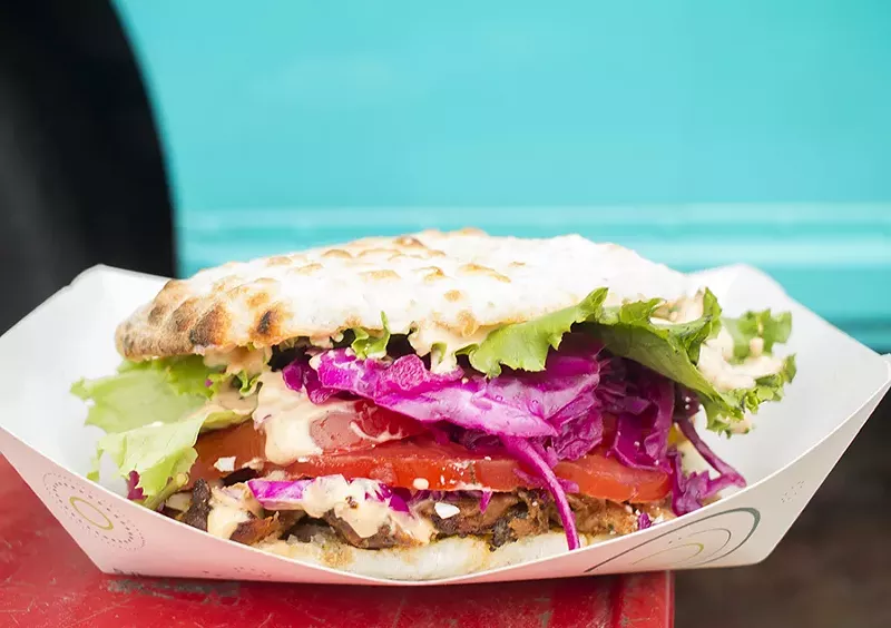 Döner comes with thinly sliced rotisserie chicken, served with somun, a wood-fired bread similar to pita. - MABEL SUEN