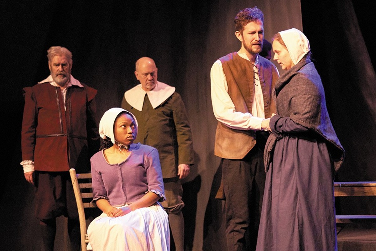 John and Elizabeth Proctor (Graham Emmons and Cynthia Pohlson, right) pray their servant Mary (Chrissie Watkins, seated) doesn't turn on them in court.