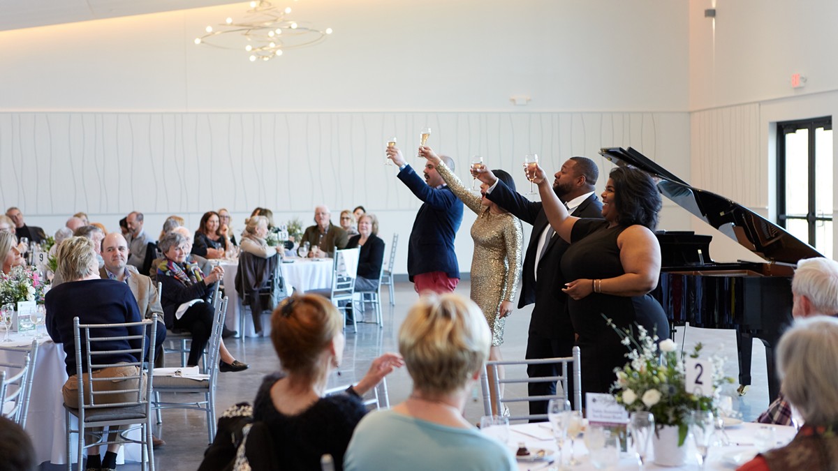 Performers raise a glass at an Opera Tastings event.