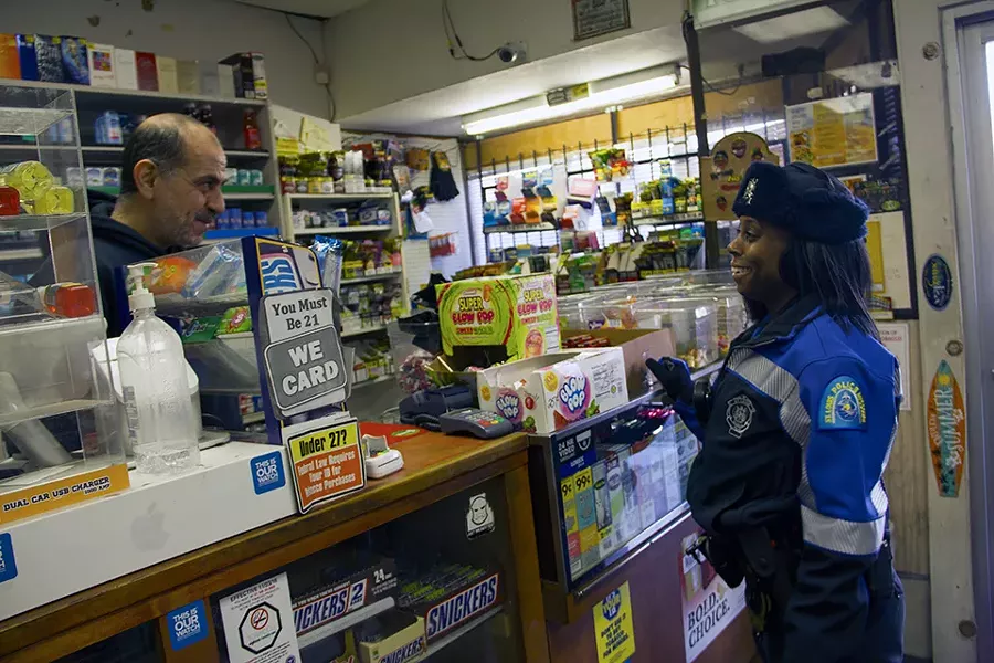 Jazmon Garrett works the beat. With many cases involving juveniles, shop owners become a critical source. - DANNY WICENTOWSKI
