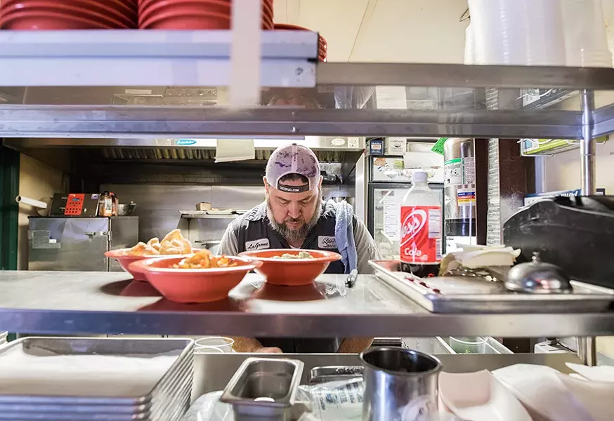 Chris Delgado in the kitchen. - MABEL SUEN