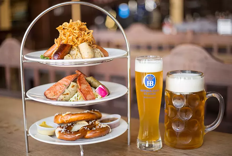 The sausage tower offers six sausages, two small pretzels, sauerkraut, German potato salad, two mustards and crispy fried onions. - MABEL SUEN