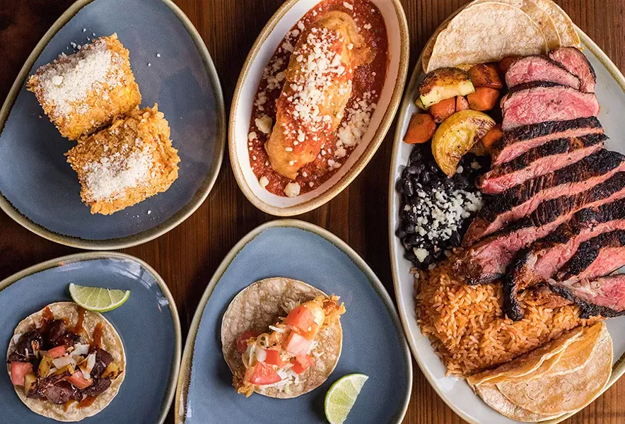 Barrio’s menu features Latin American-inspired cuisine, including street corn, a chile relleno, a ribeye, a fish taco and a pork taco. - MABEL SUEN