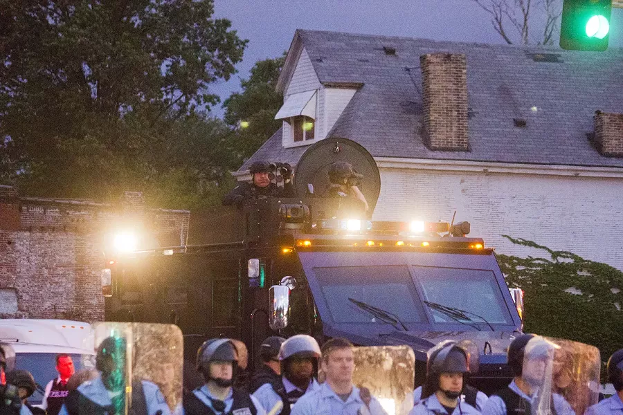 Protesters and residents were outraged at the presence of armored police vehicles and heavily armed officers.