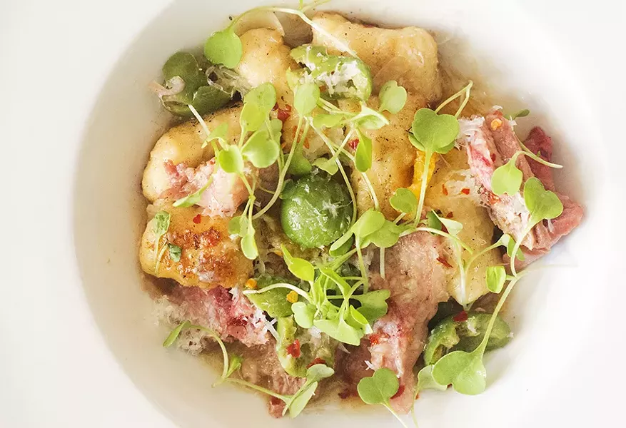 Duck confit with olive, arugula and gnocchi. - MABEL SUEN