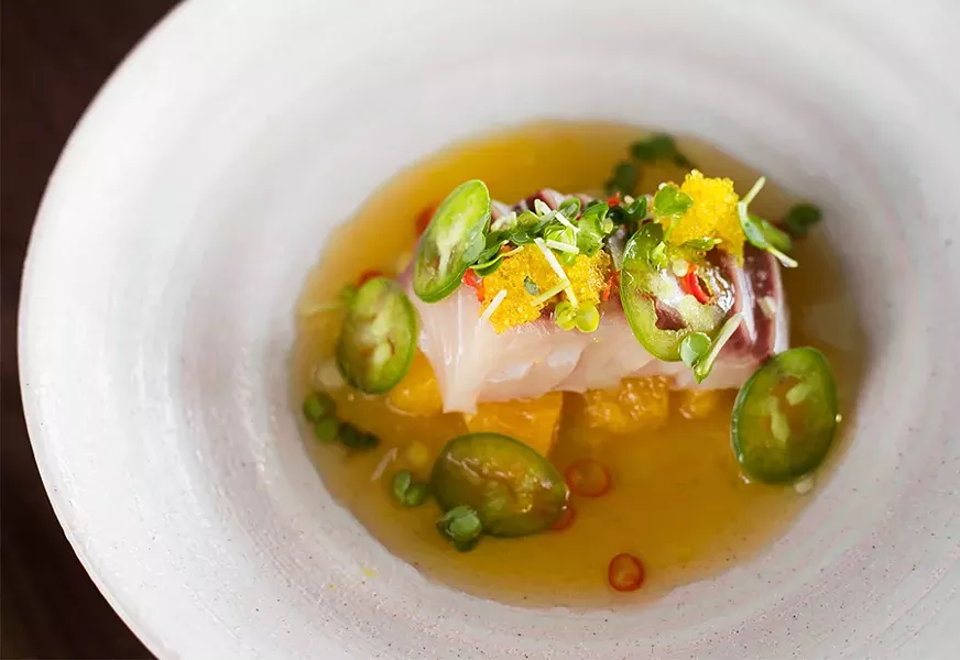 Hamachi crudo combines yellowtail with citrus and jalapeno. - MABEL SUEN