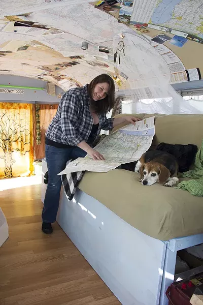 Jamie and Lucy map their upcoming bus adventure. - PHOTO BY ALLISON BABKA