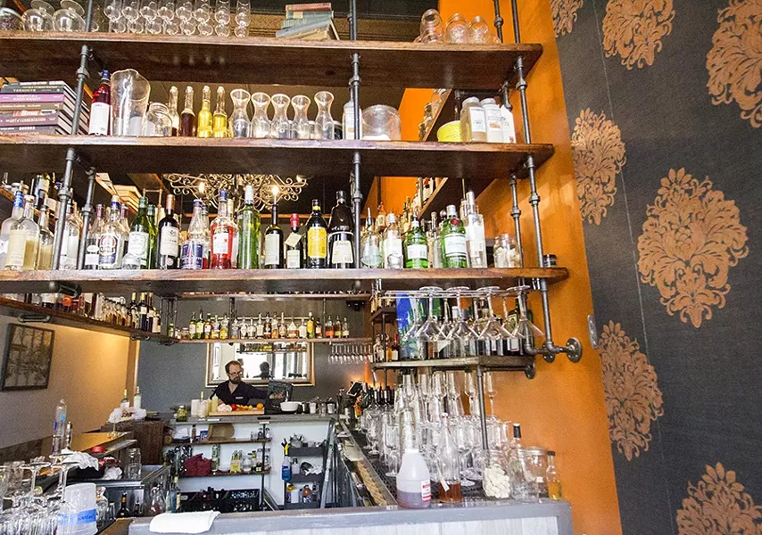 Travis Hebrank at work at the bar. - MABEL SUEN