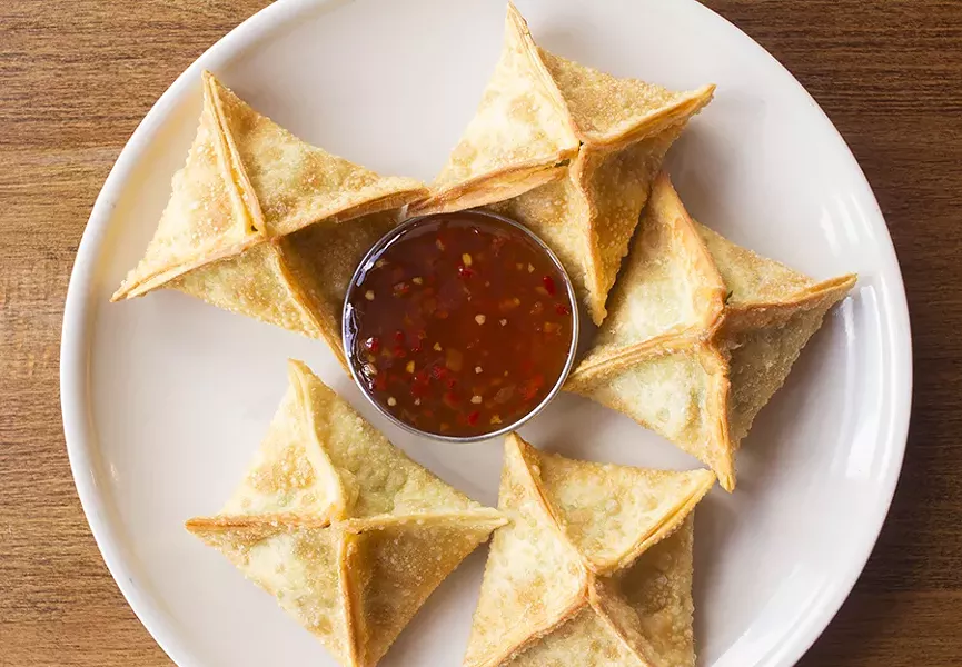Spinach-artichoke Rangoon fill fried wontons with with creamy spinach-artichoke dip. - PHOTO BY MABEL SUEN
