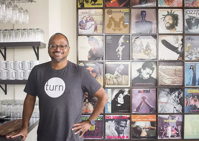 Chef David Kirkland's love of music is evident in the album covers that decorate the space. - PHOTO BY MABEL SUEN