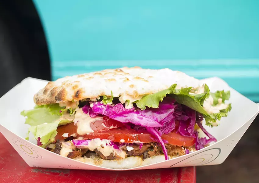 Döner comes with thinly sliced rotisserie chicken, served with somun, a wood-fired bread similar to pita. - MABEL SUEN