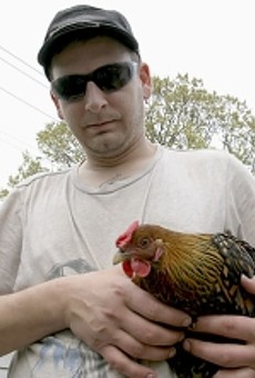 Chef holding his Partridge Rock hen