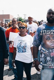 Lezley McSpadden, center, attending a protest outside the Ferguson Police Department.