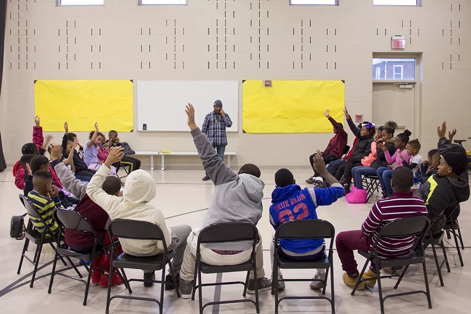 At a recent after-school Real Talk session, Muhammad asks his audience, "How many of you have been to a funeral for somebody that died at an early age due to violence?" - DANNY WICENTOWSKI