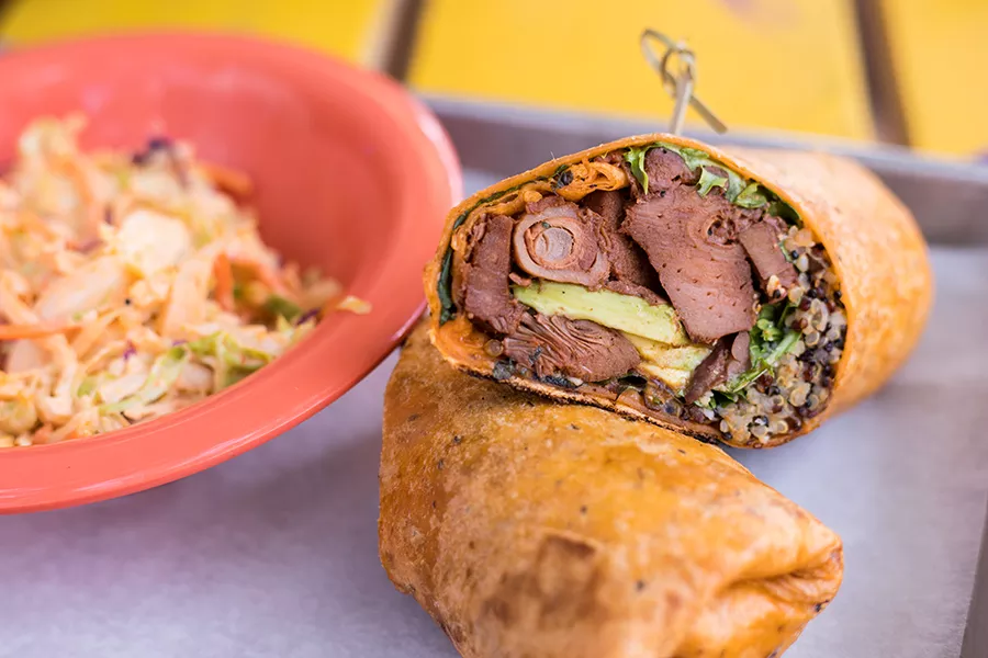 The veggie wrap is stuffed with cherry-smoked jackfruit, avocado, Brussels sprouts and cotija cheese. - MABEL SUEN