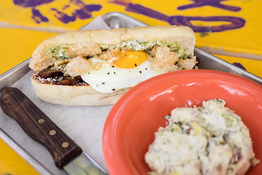 The Burley Wich" features adobo pork belly and cotija cheese on brioche. - MABEL SUEN