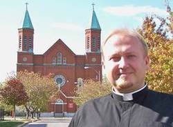 St. Stanislaus' pastor, Marek Bozek, outside the church. - STANISLAUSKOSTKA.COM