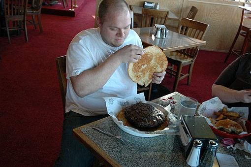 Abegg uncovers his meat at the Sunset Hills Fuddruckers on a truly Fat Tuesday, February 16. - PHOTO: ANDREW MARK VEETY