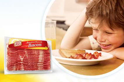 Here's a kid absolutely in love with bacon. Just look at him. - IMAGE SOURCE