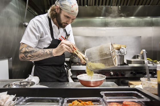 Sous chef Chris Krzysik plating the noodles for the Tonkotsu ramen. | Jennifer Silverberg