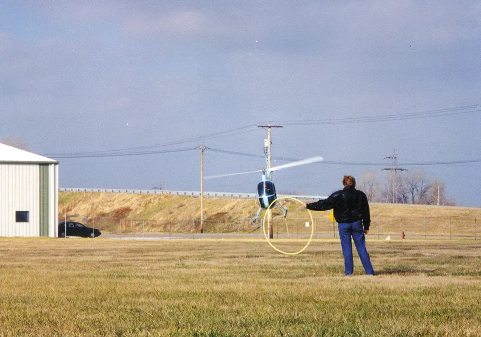 Barklage performed aerial stunts in his Mini 500 helicopter. In this photo, he's practicing snatching a hula hoop with the craft's landing gear. - COURTESY OF GENE HOFFMEYER