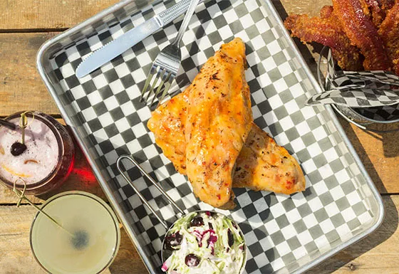Alligator ribs with red, white and blue slaw and brown-sugar bacon. - MABEL SUEN
