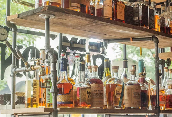 The BBQ Saloon boasts some 520 bottles of whiskey and plenty of other booze, too. - MABEL SUEN