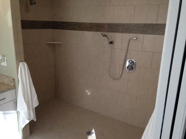 A new, wheel chair-friendly shower is part of a renovation to make Chris Sanna's new life easier. - DOYLE MURPHY