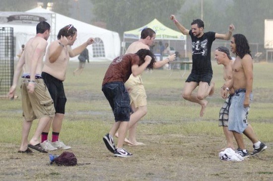 Rain-dancing festival goers at 2012's LouFest. - KHOLOOD EID