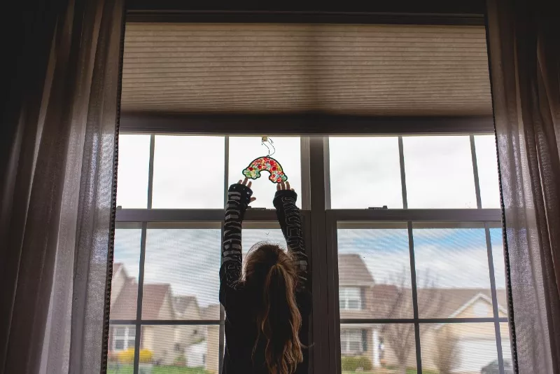 Abby Eich's submission to the Missouri Historical Society: My oldest daughter Emily (7 years old) and I heard people were trying to find ways to spread joy to others while keeping distance. She had the wonderful ideal of making a rainbow suncatcher and hanging it in the front window for others to see." - COURTESY MISSOURI HISTORICAL SOCIETY