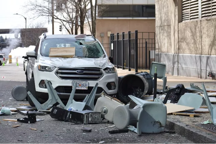 On the backside of the jail, debris thrown from the fourth floor landed on the street, sidewalk and and SUV. - DOYLE MURPHY