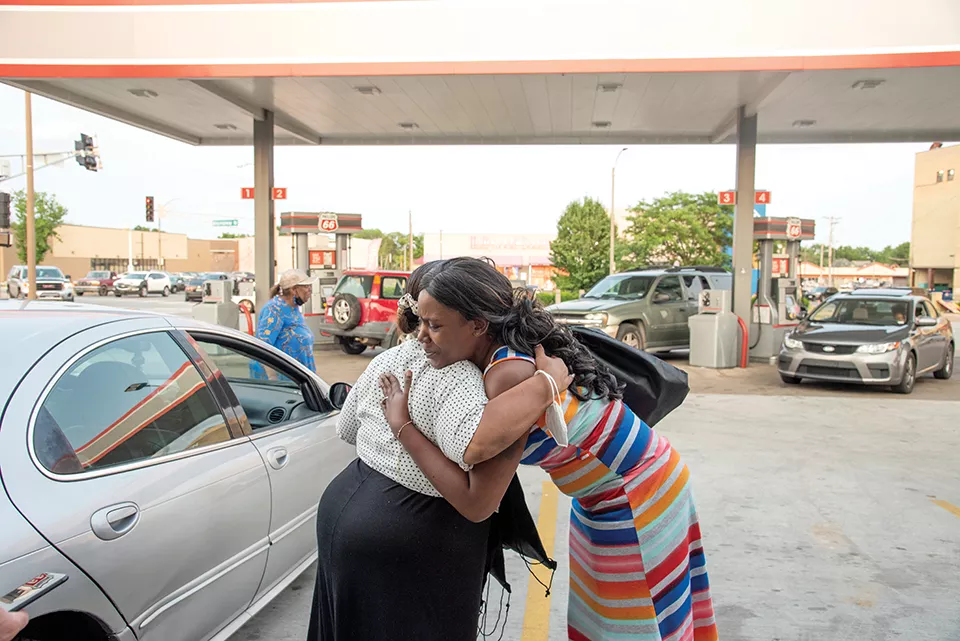 Pastor Pam, left, delivers lots of hugs during her travels. - ERIN MCAFEE