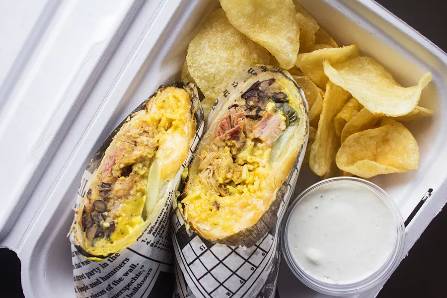 The "Cubano Phatada" features pulled pork, ham, Swiss and Chihuahua cheeses, Spanish rice, seasoned black beans, pickles and mojo mustard. - PHOTO BY MABEL SUEN