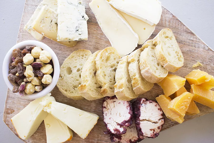 The cafe's cheese plate with an assortment of French and Italian cheeses, served with housemade bread. - PHOTO BY MABEL SUEN