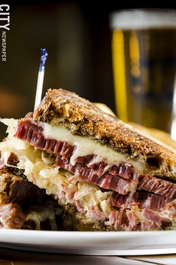 A Reuben sandwich with house-brined corned beef, sauerkraut, swiss cheese & - Thousand Island dressing on grilled, marbled rye. - PHOTO BY MARK CHAMBERLIN