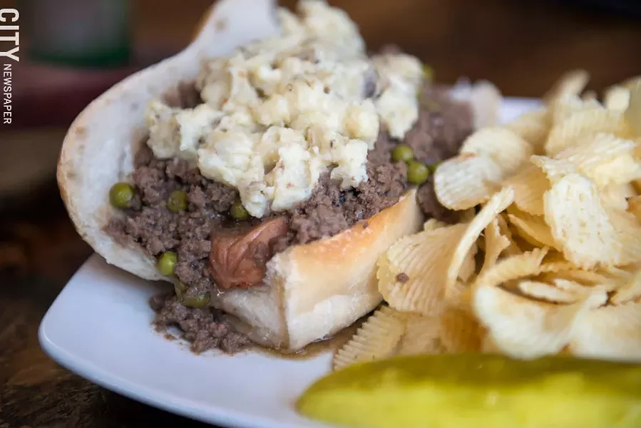 A "Sheepdog" covers a Zweigle's red hot in shepherd's pie at Barry's Old School Irish in Webster - PHOTO BY THOMAS J. DOOLEY